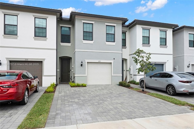 townhome / multi-family property featuring a garage