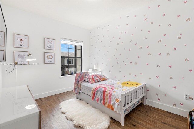 bedroom featuring wood-type flooring