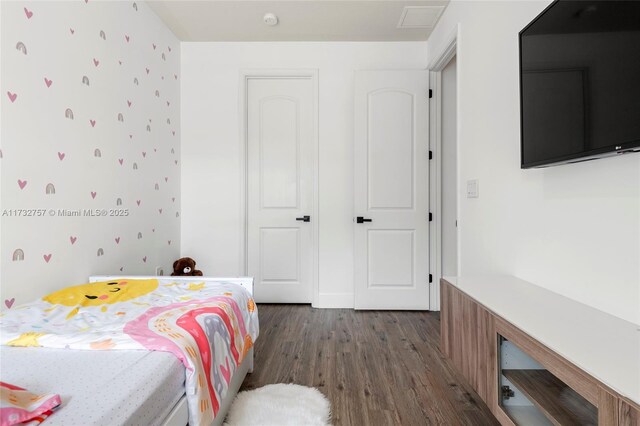 bedroom featuring dark wood-type flooring