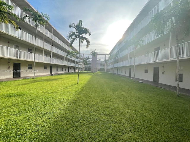 view of home's community with a lawn