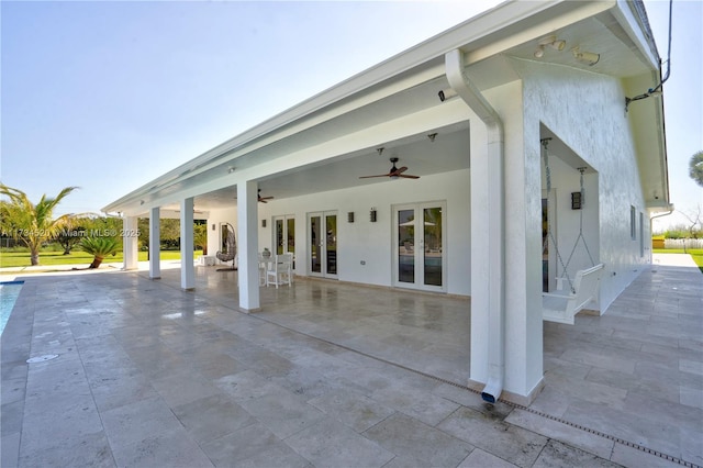 view of patio featuring ceiling fan