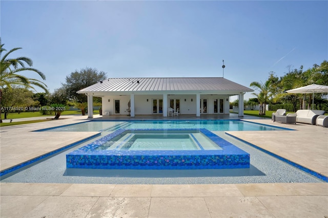 view of pool with an in ground hot tub, grilling area, and a patio