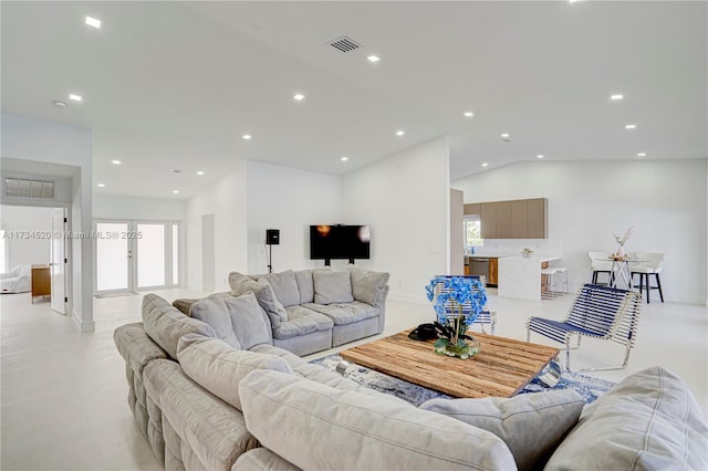 living room featuring lofted ceiling