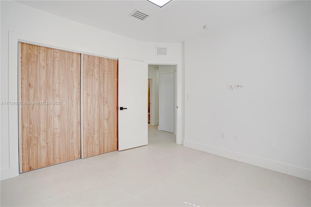 unfurnished bedroom with a closet