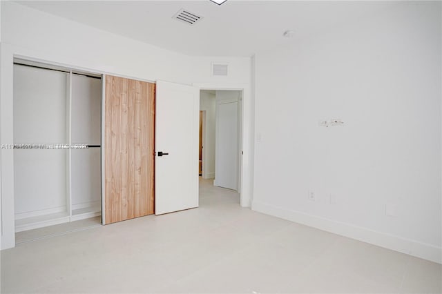 unfurnished bedroom with a closet