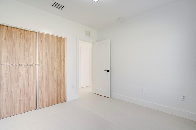 unfurnished bedroom featuring a closet