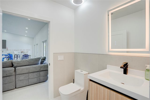 bathroom with vanity and toilet