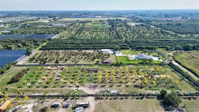 birds eye view of property featuring a rural view