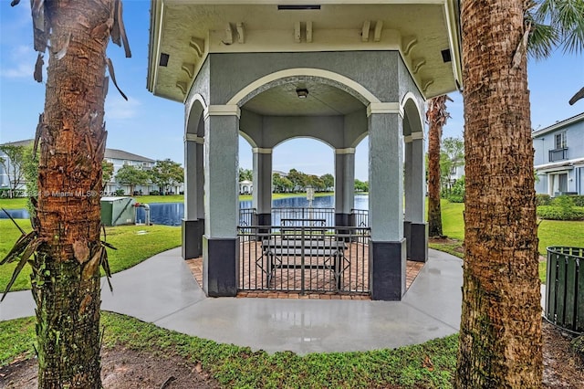 view of patio / terrace featuring a water view and a gazebo