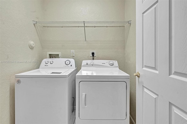 laundry area with independent washer and dryer