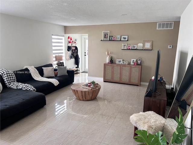 living room featuring a textured ceiling