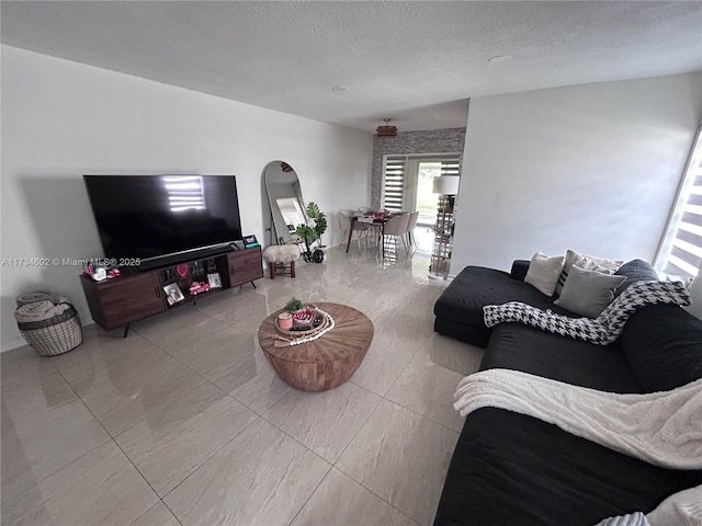 living room with a textured ceiling