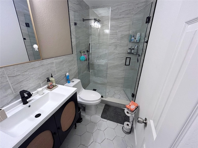 bathroom with tile walls, backsplash, vanity, walk in shower, and toilet