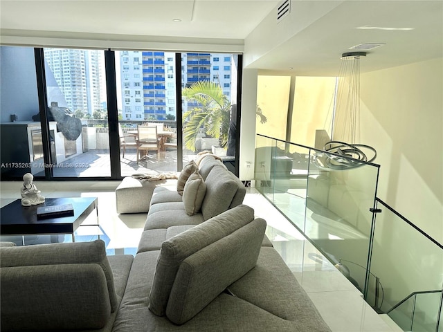 tiled living room with a wall of windows