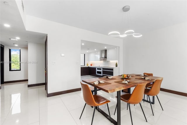 dining room featuring light tile patterned floors and a notable chandelier