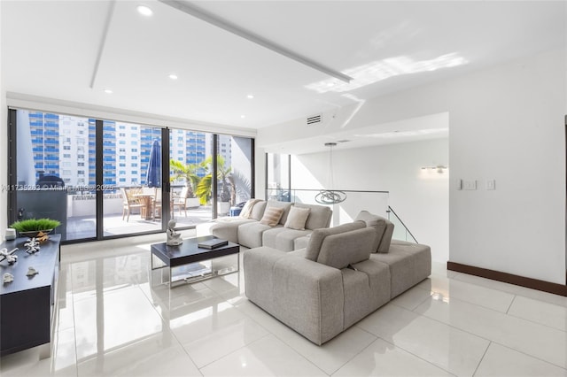 tiled living room featuring expansive windows