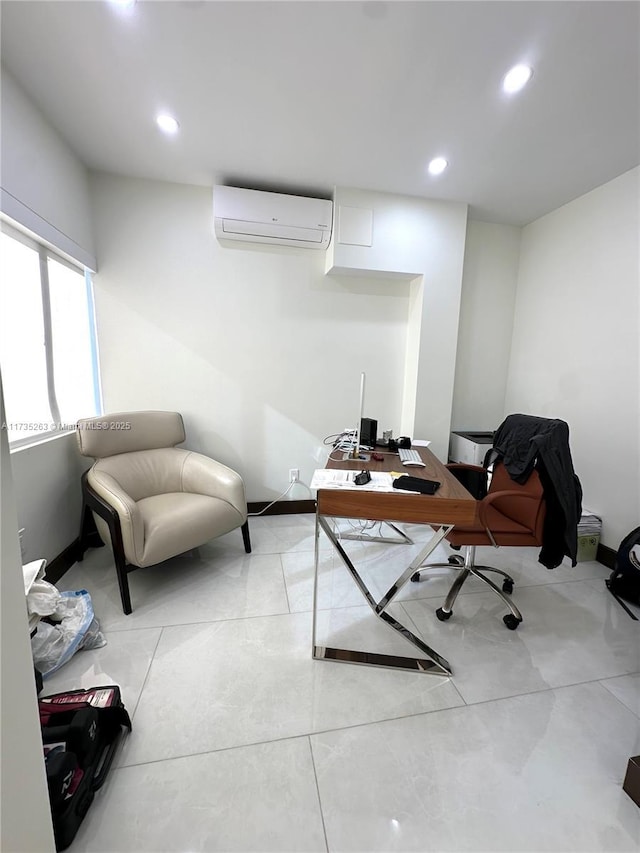 office space featuring a wall unit AC and light tile patterned floors