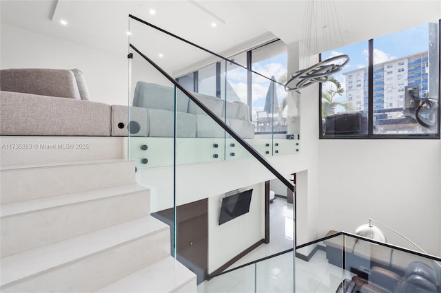 stairs featuring tile patterned flooring