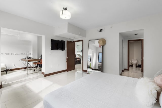 tiled bedroom featuring a wall mounted air conditioner