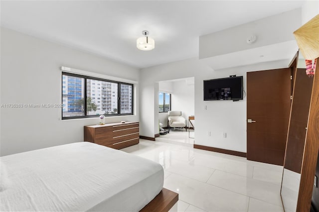 bedroom with light tile patterned floors