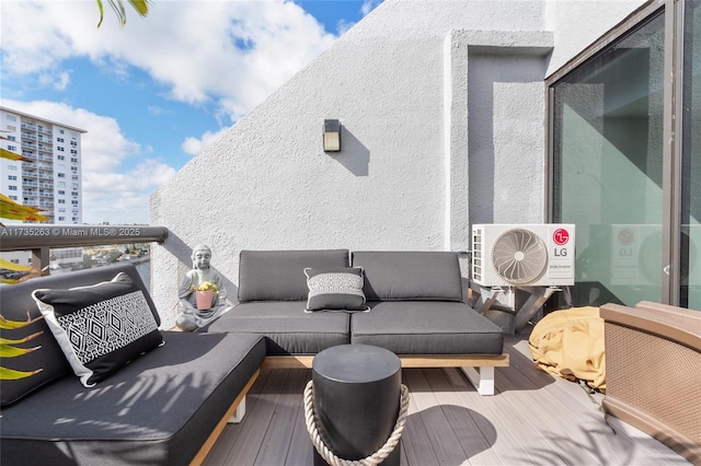 exterior space featuring ac unit and a balcony