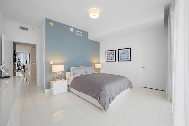 bedroom featuring light tile patterned flooring