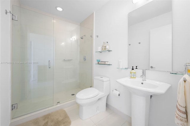 bathroom featuring walk in shower, tile patterned floors, toilet, and sink