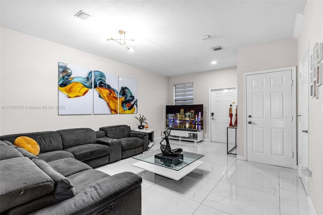 living room with a textured ceiling