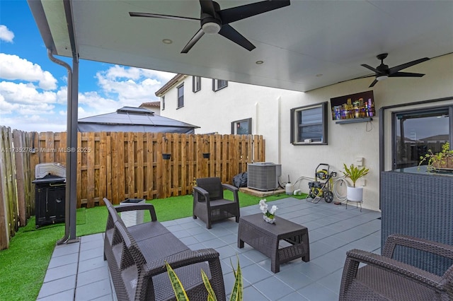 view of patio featuring grilling area, outdoor lounge area, central AC, and ceiling fan