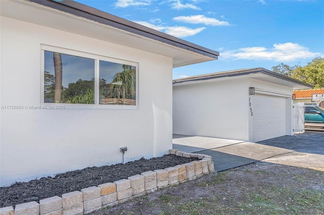 view of side of property featuring a garage