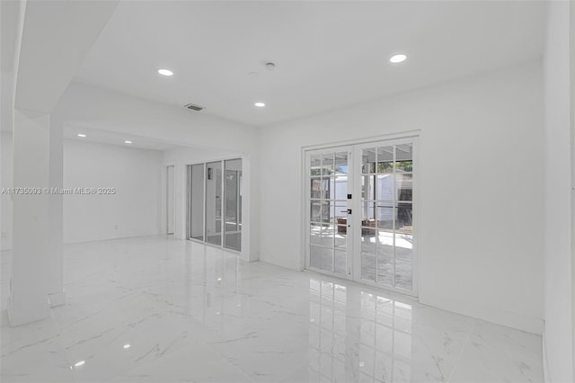 empty room featuring french doors