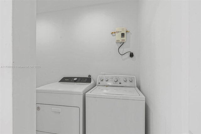 washroom with washer and dryer