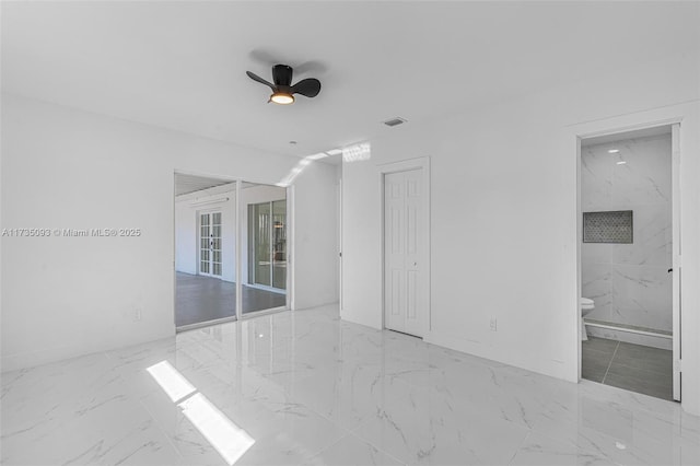 unfurnished room with ceiling fan