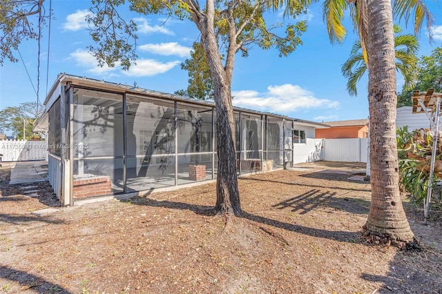 rear view of house with a sunroom