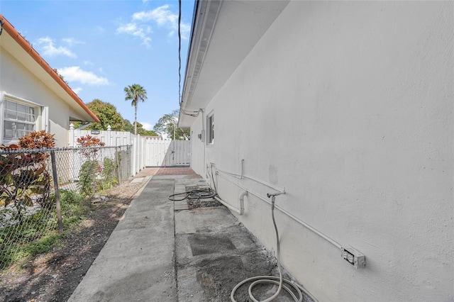 view of side of property with a patio area