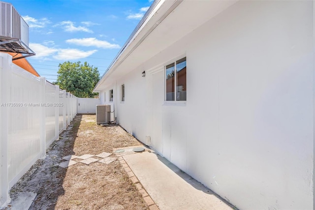 view of side of property with central AC