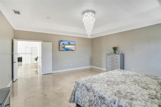 bedroom with a notable chandelier, a tray ceiling, and ornamental molding