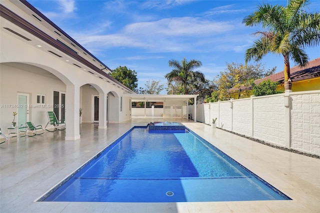 view of swimming pool with a patio area