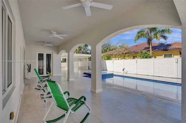 view of pool featuring a patio and ceiling fan