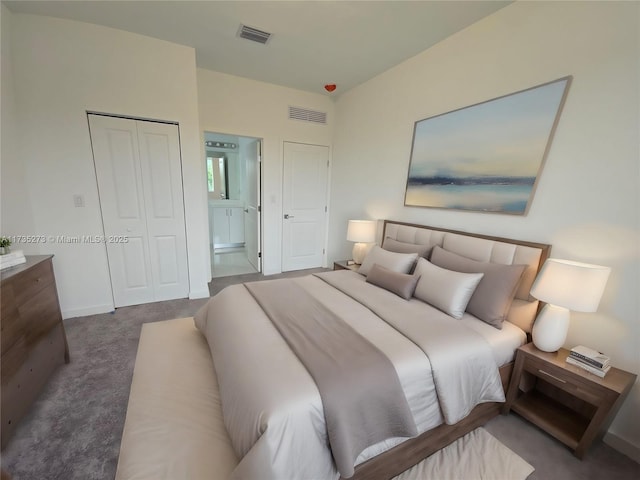 bedroom featuring connected bathroom, carpet floors, and a closet