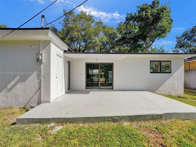 rear view of property featuring a patio