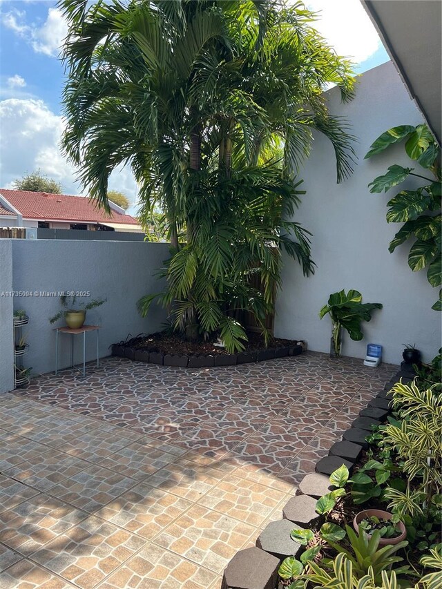 property entrance with a patio area