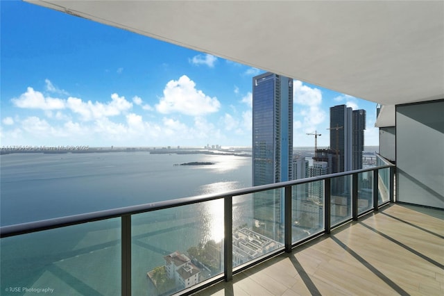 balcony featuring a water view