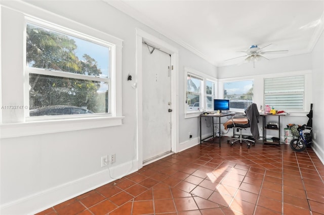 tiled office space featuring crown molding and ceiling fan