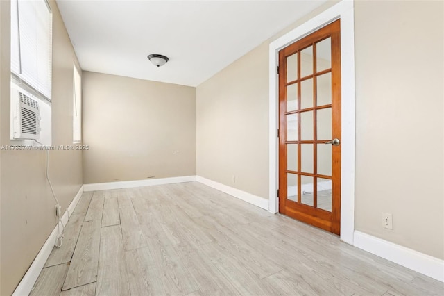 spare room with light hardwood / wood-style flooring