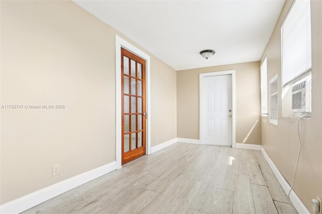 interior space featuring cooling unit and light hardwood / wood-style flooring