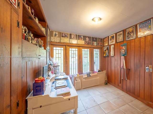 tiled office featuring wood walls