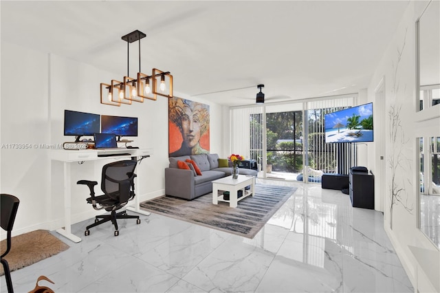 living room featuring ceiling fan and a wall of windows