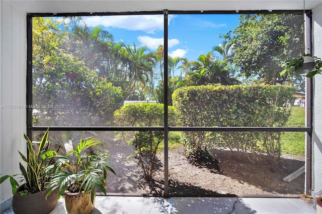 unfurnished sunroom featuring plenty of natural light