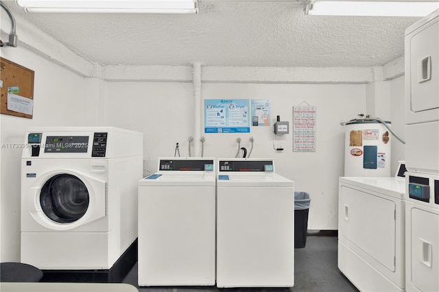 laundry area featuring stacked washer / drying machine, separate washer and dryer, water heater, and a textured ceiling